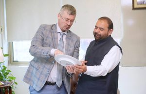 Russian Ambassador Mr. Albert P. Khorev presents a commemorative cultural plate to Federal Minister for National Heritage and Culture, Mr. Aurangzeb Khan Khichi, during a meeting in federal capital.
