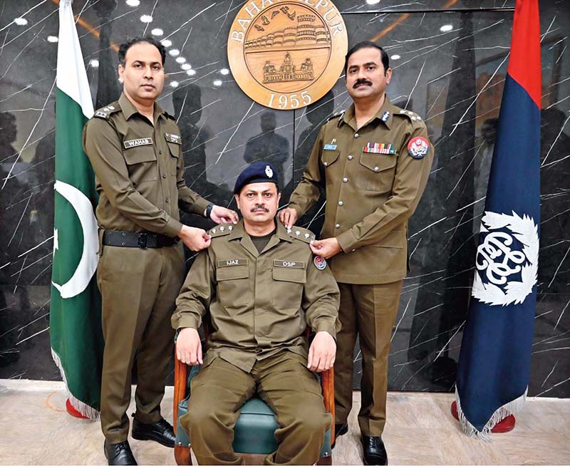 Regional Police Officer Bahawalpur, Ghazi Muhammad Salahuddin, conferring promotion badges upon seven newly promoted DSPs during a ceremony
