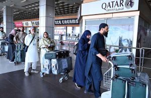 Pilgrims stand in a queue to board the first Hajj flight from Sialkot Airport under the supervision of the Ministry of Religious Affairs