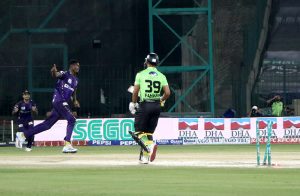 Lahore Qalandars’ Fakhar Zaman bold out by Quetta Gladiators Alzarri Joseph during the Pakistan Super League -11 cricket match at National Stadium.