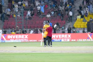 fan of Peshawar Zalmi Captain Babar Azam, comes in the ground to greet him on his century runs during the Pakistan Super League (PSL 11 ) Twenty20 cricket Qualifier match between Peshawar zalmi and Islamabad United at the National Stadium.