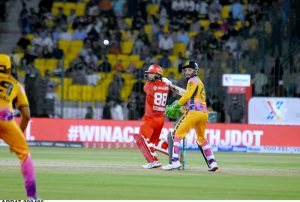 fan of Peshawar Zalmi Captain Babar Azam, comes in the ground to greet him on his century runs during the Pakistan Super League (PSL 11 ) Twenty20 cricket Qualifier match between Peshawar zalmi and Islamabad United at the National Stadium.
