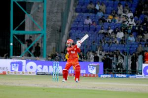 fan of Peshawar Zalmi Captain Babar Azam, comes in the ground to greet him on his century runs during the Pakistan Super League (PSL 11 ) Twenty20 cricket Qualifier match between Peshawar zalmi and Islamabad United at the National Stadium.