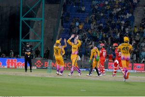 fan of Peshawar Zalmi Captain Babar Azam, comes in the ground to greet him on his century runs during the Pakistan Super League (PSL 11 ) Twenty20 cricket Qualifier match between Peshawar zalmi and Islamabad United at the National Stadium.