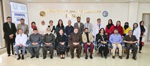Federal Minister for Poverty Alleviation and Social Safety, Syed Imran Ahmad Shah in a group photo with administration of INMOL Hospital