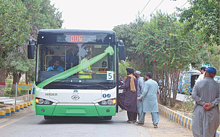 Modern green line bus operating on Quetta routes