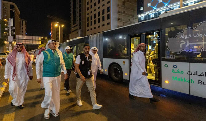 Hajj pilgrims waiting for shuttle service in Makkah
