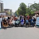 Persons with disabilities under the banner of the Society for Special Persons participate in a rally to commemorate Marka-e-Haq and express solidarity with the Pakistan Armed Forces