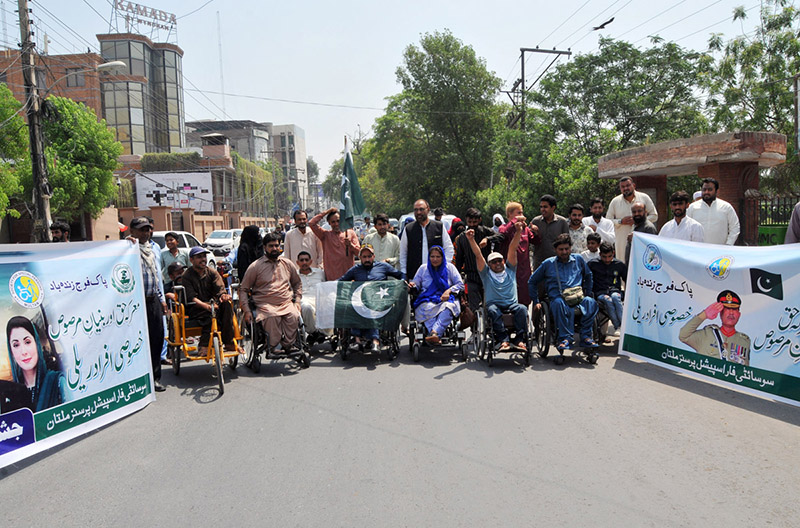Persons with disabilities under the banner of the Society for Special Persons participate in a rally to commemorate Marka-e-Haq and express solidarity with the Pakistan Armed Forces