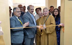 Vice Chancellor Quaid-e-Azam University, Zafar Nawaz Jaspal cutting ribbon to inaugurate the Humanistic Buddhism Research Centre.