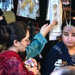 Women are busy selecting and purchasing artificial jewelry from vendor stall in preparation of Eid-ul-Azha at Resham Bazaar