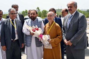 Vice Chancellor Quaid-e-Azam University, Zafar Nawaz Jaspal cutting ribbon to inaugurate the Humanistic Buddhism Research Centre.