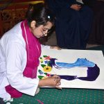 An art student busy in painting an art competition a painting competition, organized by the Punjab Arts Council Faisalabad