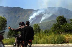 Smoke rises from Margalla Hills due to a forest fire in the Federal Capital, triggering environmental concerns and emergency response efforts
