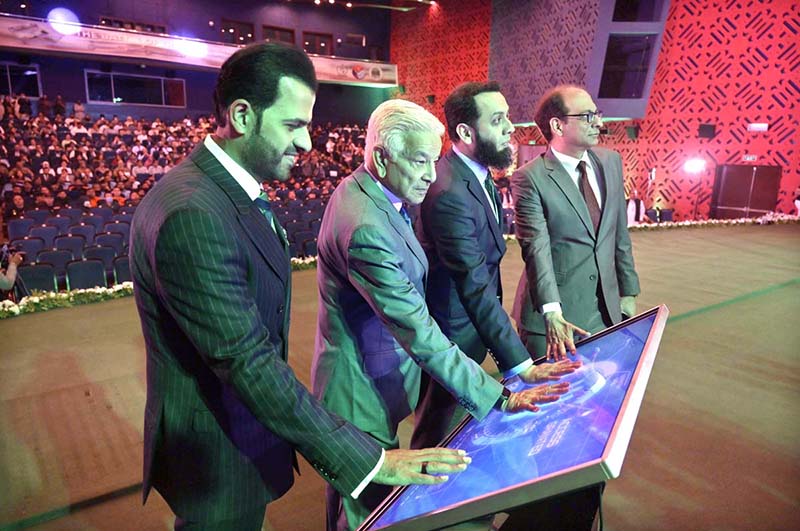 Defence Minister Khawaja Muhammad Asif and Federal Minister for Information and Broadcasting Attaullah Tarar launching picture book “Marka-e-Haq” (The Battle of Truth) at Pak-China Friendship Centre