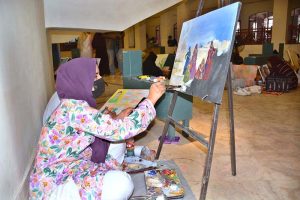 An art student busy in painting an art competition a painting competition, organized by the Punjab Arts Council Faisalabad