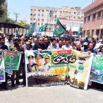 Deputy Commissioner Zain-ul-Abedin Memon leading a jashn-e- marka-e-Haq rally with People from different organizations outside Deputy Commissioner Office