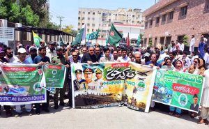 Deputy Commissioner Zain-ul-Abedin Memon leading a jashn-e- marka-e-Haq rally with People from different organizations outside Deputy Commissioner Office