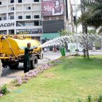 Parks and Horticulture Authority (PHA) workers are busy watering plants along the green belt to maintain the city’s greenery and beautification