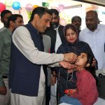 Dr. Nauman Siddique administering anti-polio drops to a child during the inauguration of a three-day anti-polio campaign in the city