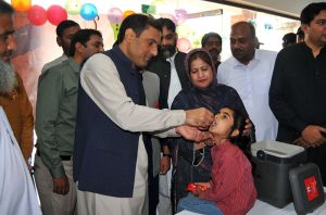 Dr. Nauman Siddique administering anti-polio drops to a child during the inauguration of a three-day anti-polio campaign in the city