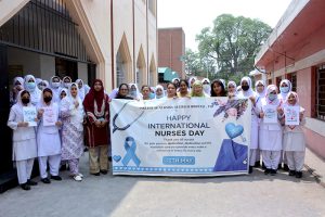 Healthcare staff and nurses participate in a walk to mark International Nurses Day at Allied Hospital-II
