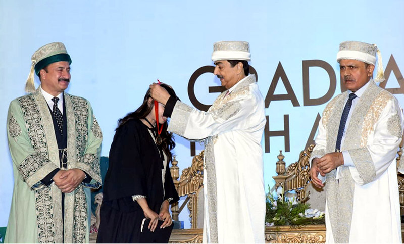 Chairman Senate Syed Yousaf Raza Gilani presents medals to graduating students during a convocation ceremony at The University of Lahore