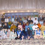 Divisional Director Social Welfare Umme Farwa Hamdani poses for a group photo with differently-abled persons during a wheelchair distribution ceremony organized by the Mainstream Association of Disabled Persons
