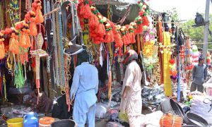 A vendor displays decorative items for sacrificial animals ahead of Eidul Azha in the city.
