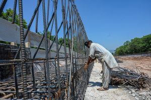 Workers on their routine development work at Park Road while World Workers Day is observing all over the world