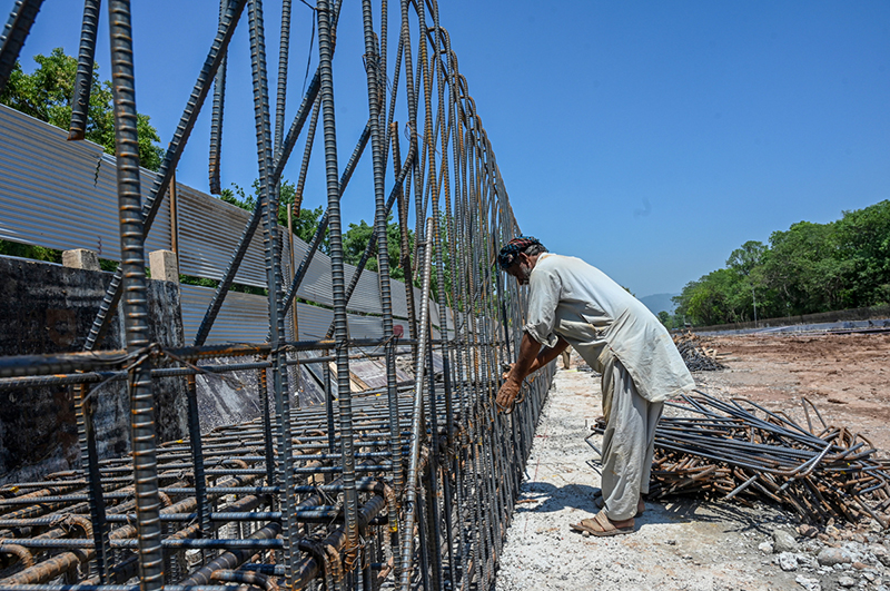 Workers on their routine development work at Park Road while World Workers Day is observing all over the world