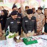 Superintendent of Center jail Abdul Karim Abbasi cutting the cake during jashn-e- marka-e-Haq celebration at center jail
