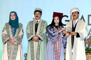 Chairman Senate Syed Yousaf Raza Gilani presents medals to graduating students during a convocation ceremony at The University of Lahore