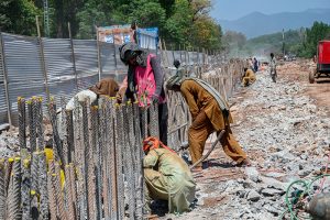 Workers on their routine development work at Park Road while World Workers Day is observing all over the world