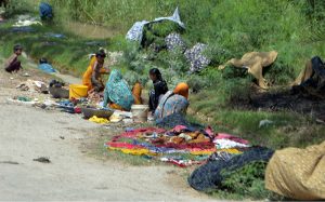 Villager women washing the cloth on roadside at Tando Hyder