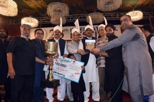 Chairman Punjab Higher Education Commission (PHEC) Prof Dr Iqrar Ahmad Khan along with Vice Chancellor (VC) University of Agriculture Faisalabad (UAF) Prof Dr Zulfiqar Ali is giving away first prize along with trophy to winner of beautiful goat competition during 28th International Festival 2026 at UAF on late Saturday night
