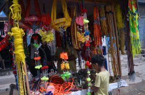 A child purchases decorative accessories for sacrificial animals ahead of the upcoming Eid al-Adha.