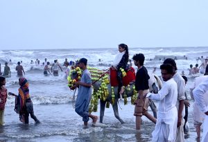 Children enjoy camel ride at sea view during the festivities on the second day of Eidul Azha
