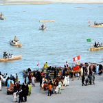 Families enjoying boat rides at the Indus River during the third day of Eid-ul-Azha