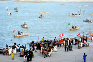 Families enjoying boat rides at the Indus River during the third day of Eid-ul-Azha