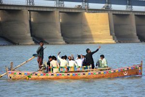 Families enjoying boat rides at the Indus River during the third day of Eid-ul-Azha