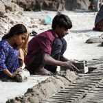 Workers makes bricks using traditional methods at brick factory Tando hyder area