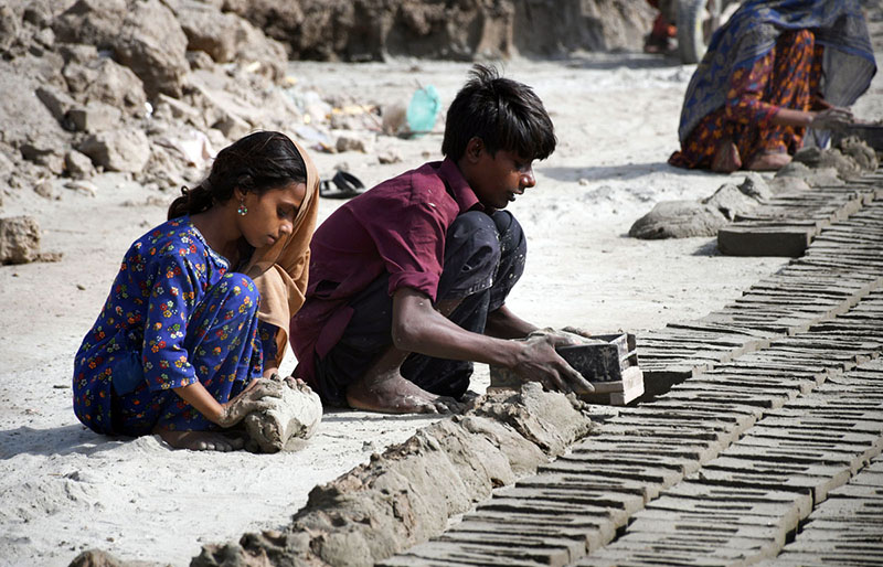 Workers makes bricks using traditional methods at brick factory Tando hyder area