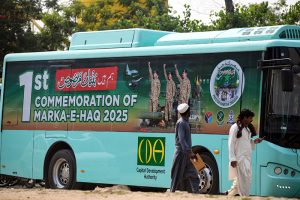 Posters displayed on electric buses in the federal Capital to mark the completion of one year of the victory of Marka-e-Haq Bunyan-ul-Marsoos