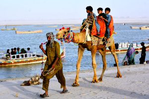 Children bathing in the Indus River to get relief from the heat during the third day of Eid-ul-Azha