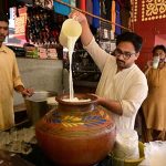 Vendor displaying traditional drink (Lassi) to attract the customer at bacha khan chowk