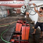 A worker is busy at work in an ice factory as the International Labour Day is observing all over the world