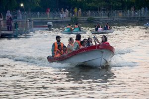A family enjoys boating at Race Course Park as visitors spend their holiday at the recreational venue