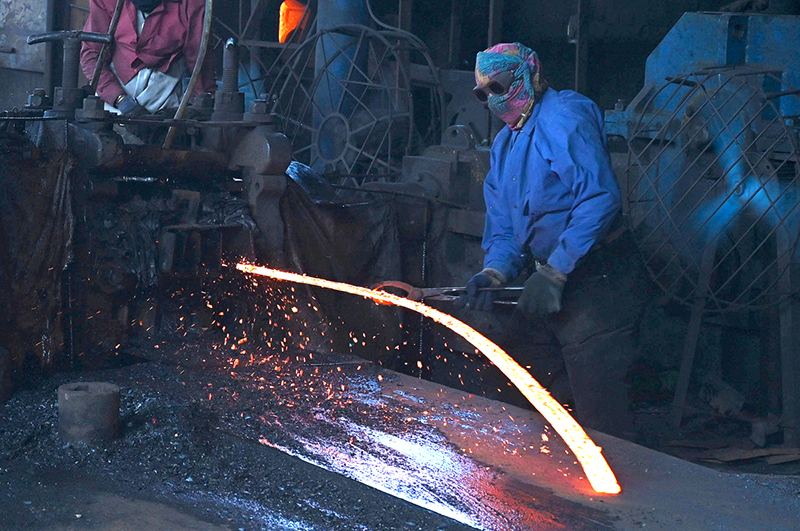 Labourers work at an iron factory in an industrial area as International Workers' Day is observed worldwide, commemorating the 1886 Chicago workers’ movement for labour rights. In Pakistan, May 1 was declared a public holiday following the country’s first labour policy introduced in 1972