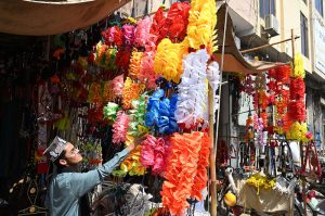 a vendor is selling charcoal grills (angethe) at Muslim Bazaar
